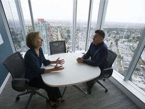 Metro Vancouver employees Rachel Boutilier and Kevin Haw in a break-out room, an informal meeting space, at the new Metro Vancouver office space in the Metrotown III office building in Burnaby.