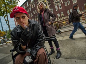 Kyle Lloyd with his mother, Lisa Lloyd, near St. Paul's Hospital. The 29-year-old is a quadriplegic drug addict who also has psychosis. Because of his challenges, there is no supportive housing that works for him. He's been in St. Paul's since August because there's nowhere else to put him.