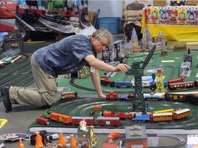 Model train enthusiast Gordon Hall in action during the 35th Annual Vancouver Train Expo at the PNE Forum on Sunday.