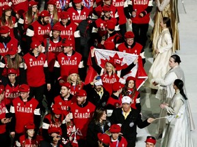 The Canadian delegation marches in the closing ceremony of the Sochi Olympics on Feb. 23, 2014.