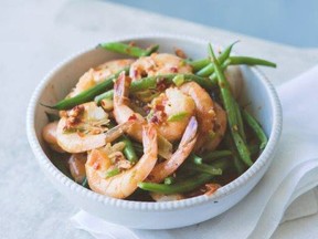 A spicy sauce coats shrimp in this quick and easy recipe.