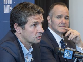Newly appointed Impact head coach Rémi Garde responds to questions as team president Joey Saputo listens during a news conference in Montreal on Wednesday, November 8, 2017.