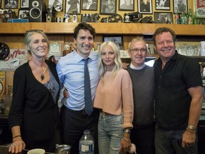 Prime Minister Justin Trudeau and Liberal Party candidate Gordon Hogg (second from right) poses for a photo with Five Corners Cafe owners (from left) Catherine, Shannon and Rice Honeywell during a visit in White Rock on Nov. 15, 2017.