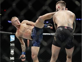 TJ Dillashaw, left, kicks Cody Garbrandt during a bantamweight title mixed martial arts bout at UFC 217 earlier this month. Dillashaw won the fight.