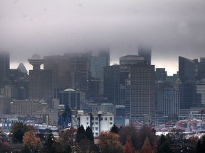FILE PHOTO Vancouver under a cloud as the city records it's most number of rainy days for October, in Vancouver, BC., October 31, 2016. A major climate-change study predicts temperatures in Metro Vancouver will exceed those of present-day Southern California in the coming decades, while heavier fall rain will lead to flooding and erosion problems.