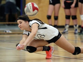 Belmont Bulldogs Miranda Cyr digs the ball against the Claremont Spartans during their match at Belmont Secondary in Victoria on Sept. 27, 2016.