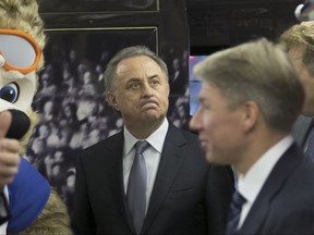Vitaly Mutko, Russian Federation Deputy Prime Minister & Local Organising Committee Chairman reacts walking inside a metro train branded for the 2018 World Cup during a ceremony in Moscow, Russia, on Tuesday, Nov. 28, 2017. (AP Photo/Ivan Sekretarev)