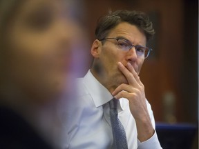 Mayor Gregor Robertson listens to speakers inside City Hall in Vancouver, B.C., November 29, 2017.