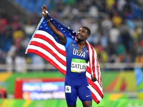 Justin Gatlin of the United States waves to the crowd after taking second place in the men's 100m final at the Olympic stadium during the Rio 2016 Olympic Games on August 14, 2016 in Rio de Janeiro, Brazil.