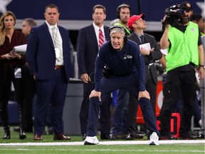 Head coach Pete Carroll of the Seattle Seahawks watches the game against the Dallas Cowboys from the sidelines at AT&T Stadium on December 24, 2017 in Arlington, Texas.