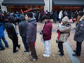 As shoppers search for the best post-Christmas deals, a study by the University of British Columbia has found bargain hunters tend to treat customer-service staff as less human as compared with those who aren't looking for a good deal. People wait in a lineup to get into a Nike store during Boxing Day sales at the McArthur Glen Designer Outlet mall, in Richmond, B.C., on Tuesday, December 26, 2017.