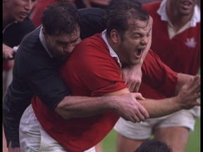Eddie Evans of Canada is tackled by New Zealand during the 1991 Rugby World Cup. The Canadian team is to be inducted into the B.C. Sports Hall of Fame.