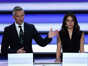 Presenter, Gary Lineker and Presenter, Maria Komandnaya speak to the audience during the Final Draw for the 2018 FIFA World Cup Russia at the State Kremlin Palace on December 1, 2017 in Moscow, Russia. (Photo by Matthias Hangst/Bongarts/Getty Images)