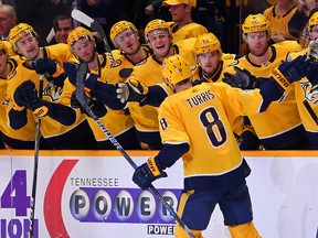 Kyle Turris of the Nashville Predators is congratulated by teammates after scoring a shootout goal against the Montreal Canadiens at Bridgestone Arena in Nashville.