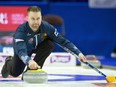 Skip Brad Gushue, of St.John's, N.L., throws a rock during the Canadian Olympic curling trials in Ottawa on Sunday, December 3, 2017.