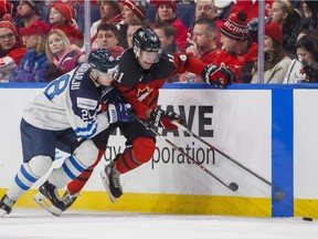 Canucks prospect Jonah Gadjovich skates against Finland's Henri Jokiharju during the third period of IIHF World Junior Championship preliminary round hockey action in Buffalo, N.Y. Tuesday December 26, 2017.