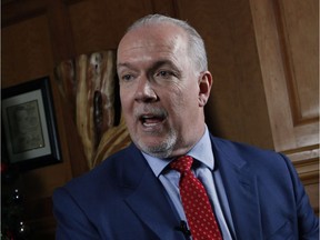 Premier John Horgan says he thinks it's 'outrageous' that the CBC fired legislative reporter Richard Zussman for co-authoring a book without obtaining proper approval.
