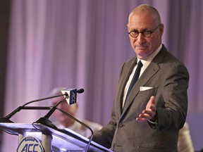 ESPN president John Skipper gestures as he talks during a news conference at the Atlantic Coast Conference Football Kickoff in Charlotte, N.C., Thursday, July 21, 2016. The sports network says its former president, George Bodenheimer, will take over as acting head of the company for the next 90 days as Skipper steps down to take care of a substance abuse problem. THE CANADIAN PRESS/AP-Chuck Burton