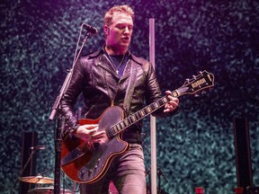 Josh Homme of Queens of the Stone Age performs at the 2017 KROQ Almost Acoustic Christmas at The Forum on Saturday, Dec. 9, 2017, in Inglewood, Calif.