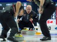 Skip Kevin Koe watches a shot approach the house during Olympic curling trials action against Team Morris on Dec. 7, 2017