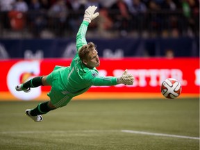 Vancouver Whitecaps goalkeeper David Ousted makes a save against the Los Angeles Galaxy shot during a 2014 game at B.C. Place.