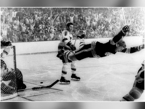 In this May 10, 1970, file photo, Boston Bruins' Bobby Orr goes into the air after scoring a goal against the St. Louis Blues that won the Stanley Cup for the Bruins in Boston. (Ray Lussier/The Boston Herald via AP, File)