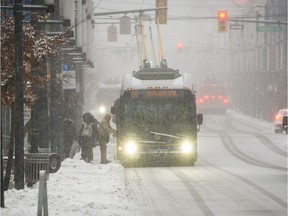 B.C.'s south coast is being told to prepare for snow, which is expected this week on Tuesday and Thursday, followed by sub-zero temperatures. In this file photo, people can be seen in downtown Vancouver during a snow storm on Feb. 6, 2017.