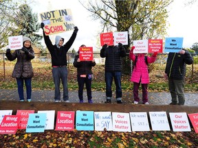 Some of the protestors who have been on the site blocking entrance to Horizon North as staff and trucks begin construction on this urgently needed housing project, in Vancouver, BC., December 3, 2017. The Supreme Court of British Columbia has ordered protesters in a south Vancouver neighbourhood to stop interfering with efforts to build temporary modular housing for homeless people.