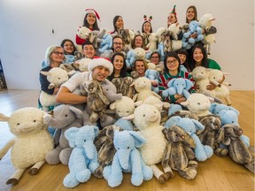Staff in realtor Bob Rennie's Vancouver office display toy stuffies similar to those Rennie donated to the The Province Empty Stocking Fund.