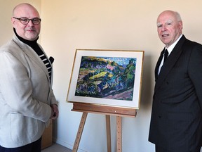 From left, Darrin Martens, Gail and Stephen A. Jarislowsky chief curator, and Micheal Audain of the Audain Art Museum with the recently purchased Emily Carr painting Le Paysage.