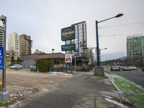 The White Spot restaurant site on West Georgia Street in Vancouver and the adjacent parking lot to the east, in foreground, have been sold for $245 million to a Hong Kong developer.