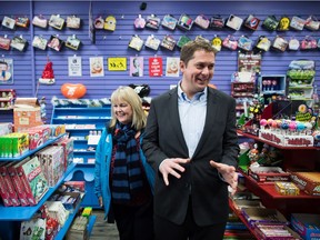 Conservative Leader Andrew Scheer and South Surrey-White Rock Conservative byelection candidate Kerry-Lynne Findlay visit a candy store while campaigning Monday in Surrey,