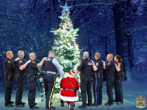ABBOTSFORD, B.C.: DEC. 20, 2017 – Abbotsford Police Department has released their annual Christmas card for 2017. Titled Operation Resolution, this year's card pays tribute to Const. John Davidson who died in the line of duty earlier this fall. The card features APD Chief Bob Rich as Santa taking a knee in front of a Christmas tree, flanked by officers from Lower Mainland police forces.