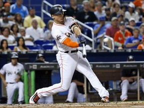 Miami Marlins slugger Giancarlo Stanton hits a home run in the third inning of a June 23, 2017 Major League Baseball game against the Chicago Cubs in Miami. Stanton, who hit 59 home runs and had 132 RBI in 2017, agreed to a trade to the New York Yankees on Dec. 11, 2017.