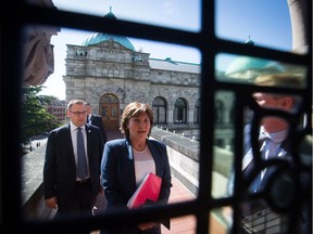 Former British Columbia Premier Christy Clark walks from her office to the Legislature Chamber to respond to the Throne Speech and attend a confidence vote in Victoria on June 29. The minority Liberals were forced to allow the NDP to form government with the backing of the Green party.