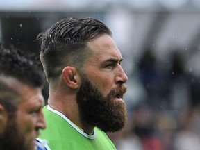 Clermont's South African lock Mathrinus Van Der Westhuizen (L) and Clermont's Canadian lock Jamie Cudmore (R) look on before the French Top 14 rugby union match between Clermont and Stade Francais Paris at the Michelin Stadium in Clermont-Ferrand, central France, on May 22, 2016.