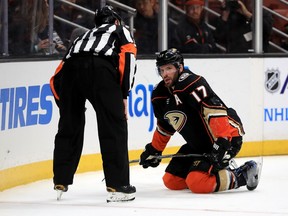 Ryan Kesler of the Anaheim Ducks talks with referee Kelly Sutherland after being hit during a Dec. 29 game against the Calgary Flames. Kesler, who returned to the lineup two days earlier after missing 37 games because of hip surgery, was one of the key Ducks missing from the team's lineup to start the season.