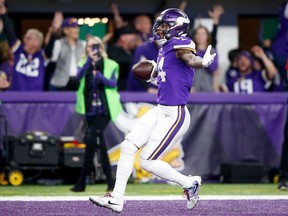 Stefon Diggs of the Minnesota Vikings celebrates after scoring a touchdown to defeat the New Orleans Saints in the NFC Divisional Playoff game at U.S. Bank Stadium on January 14, 2018 in Minneapolis, Minnesota.