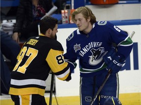 Vancouver Canucks forward Brock Boeser (6) shakes hands with Pittsburgh Penguins forward Sidney Crosby (87) after Boeser won the accuracy shooting contest during the Skills Competition, part of the NHL All-Star Game weekend, Saturday, Jan. 27, 2018, in Tampa, Fla. The game takes place Sunday afternoon.