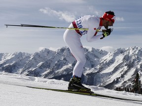 Brian Mckeever of Canada competes to win his gold medal in the cross country men's 10km, free, visually impaired event at the 2014 Winter Paralympic, Sunday, March 16, 2014, in Krasnaya Polyana, Russia.