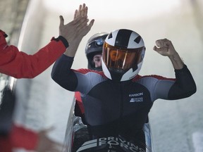 In this Jan. 6, 2018 photo Canadian winners Justin Kripps,front, and Alexander Kopacz  celebrate after the men's 2-man bob World Cup race in Altenberg, Germany.