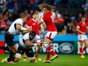 Jeff Hassler of Canada breaks through the Romania defence as he scores their second try during the 2015 Rugby World Cup Pool D match between Canada and Romania at Leicester City Stadium on October 6, 2015 in Leicester, United Kingdom.