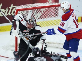 Goaltender Todd Scott of the Vancouver Giants makes a save against Davis Koch of the Edmonton Oil Kings a Nov. 12 game in Langley. On Wednesday, Scott and Koch were traded for one another.