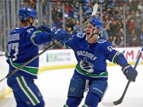 Nikolay Goldobin is greeted by Troy Stecher after scoring a highlight-reel goal Dec. 30 against the Kings.
