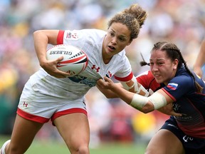 Breanne Nicholas of Canada pushes away from the defence in the Women's Bronze Finals match against Russia during day three of the 2018 Sydney Sevens at Allianz Stadium on January 28, 2018 in Sydney, Australia.