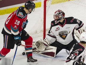 Vancouver Giants goalie Davis Tendeck makes a save in front of Kelowna Rockets Leif Mattson during the first period of Saturday's 3-2 Giants win  at the LEC. Tendeck is one of the reasons Vancouver is a contender this season.