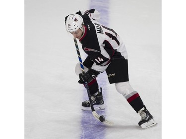 Vancouver Giants #14 James Malm balances the puck on his stick during the pregame skate prior to playing the Portland Winterhawks in a regular season WHL hockey game at LEC, Vancouver, January 20 2018.