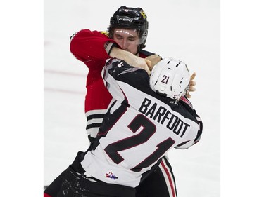 Vancouver Giants #21 Aidan Barfoot and Portland Winterhawks #4 Connor MacEeacher fight in the second period of a regular season WHL hockey game at LEC, Vancouver, January 20 2018.