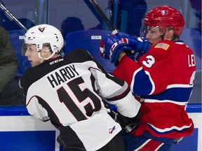 File photo: Vancouver Giants Owen Hardy and Spokane Chiefs Matt Leduc crash along the boards.