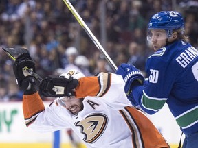 Vancouver Canucks centre Markus Granlund (60) fights for control of the puck with Anaheim Ducks centre Ryan Kesler (17) during first period NHL action in Vancouver in January 2018.